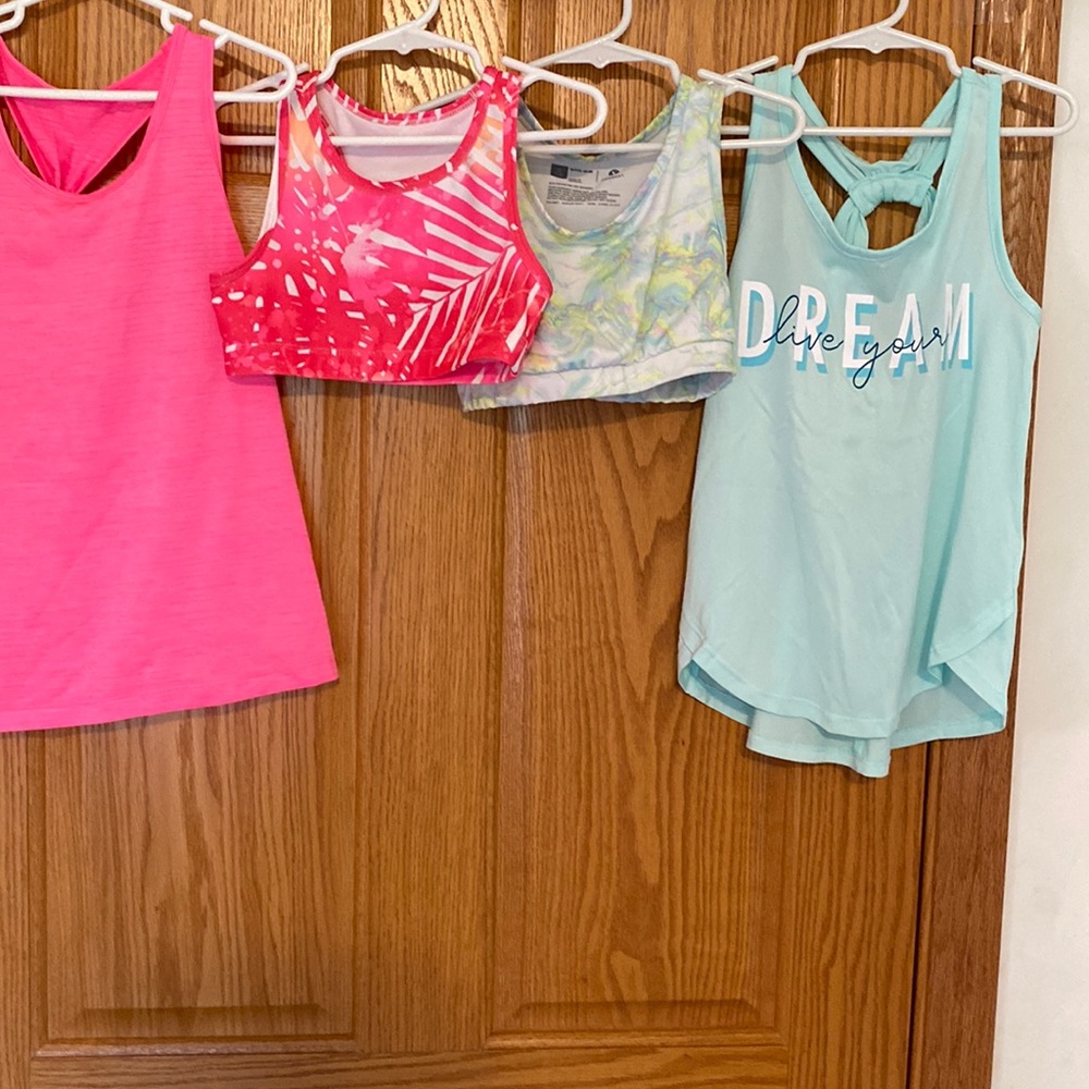 Two tanks and sports bras